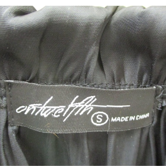 Beautiful black silky peasant blouse. Cute ruffle detail on top with neck tie. - Picture 4 of 7